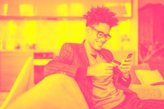 A guy with glasses, using SMS for eCommerce